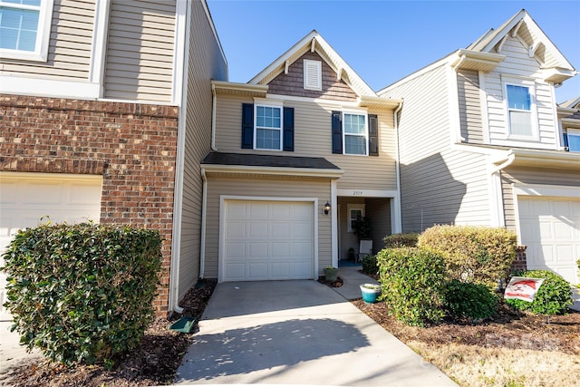 multi unit property featuring a garage