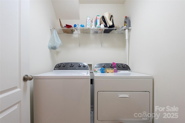 laundry area featuring washing machine and clothes dryer