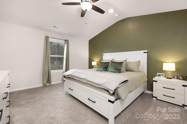 carpeted bedroom with vaulted ceiling and ceiling fan