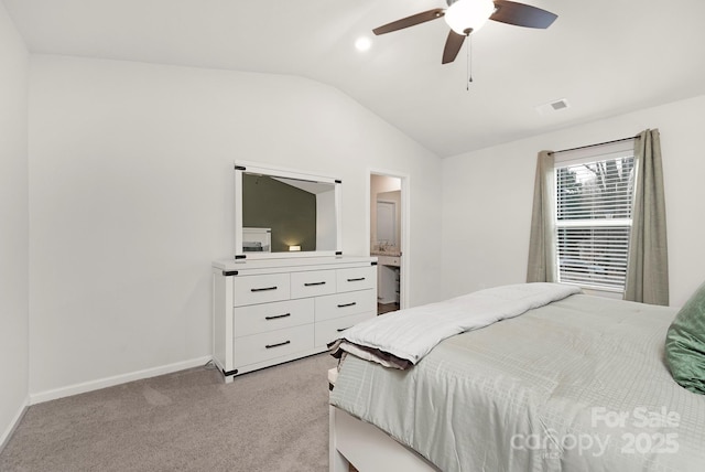 carpeted bedroom with vaulted ceiling and ceiling fan