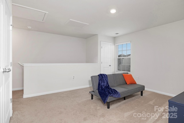 living area with light carpet