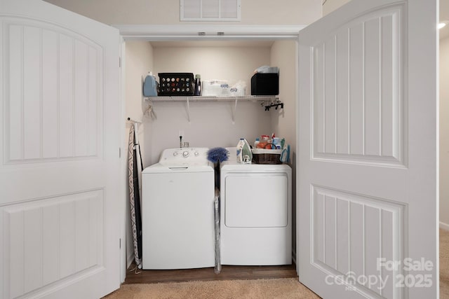 washroom with washing machine and dryer