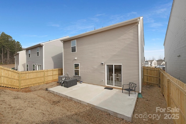 rear view of property featuring a patio