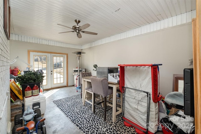 office space with concrete flooring, french doors, and ceiling fan