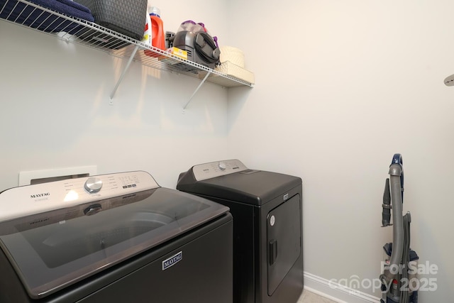 laundry area featuring washing machine and dryer