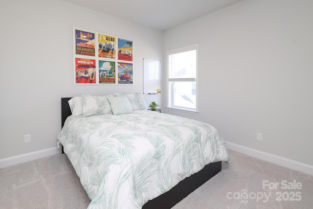 bedroom with light colored carpet