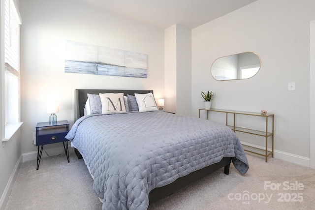 bedroom featuring light carpet