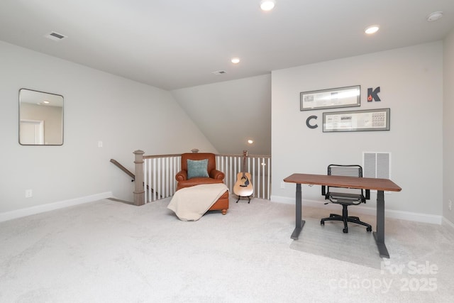 office featuring vaulted ceiling and light carpet