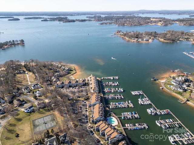 birds eye view of property with a water view