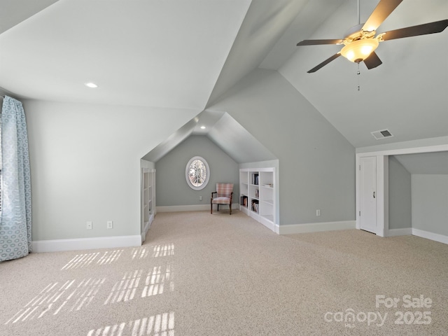 bonus room featuring light carpet, lofted ceiling, and ceiling fan