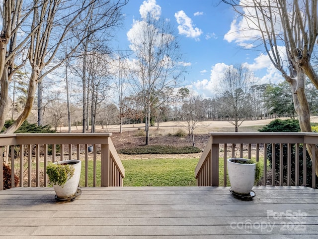 deck featuring a lawn