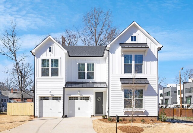 modern inspired farmhouse with a garage