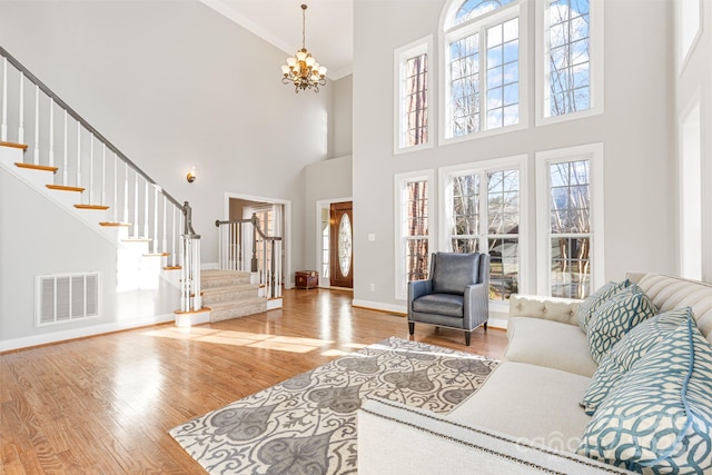 living room featuring hardwood / wood-style floors and a notable chandelier