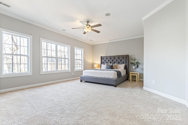 bedroom featuring multiple windows, crown molding, and light colored carpet