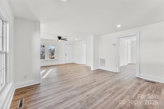 unfurnished living room with light hardwood / wood-style floors and ceiling fan