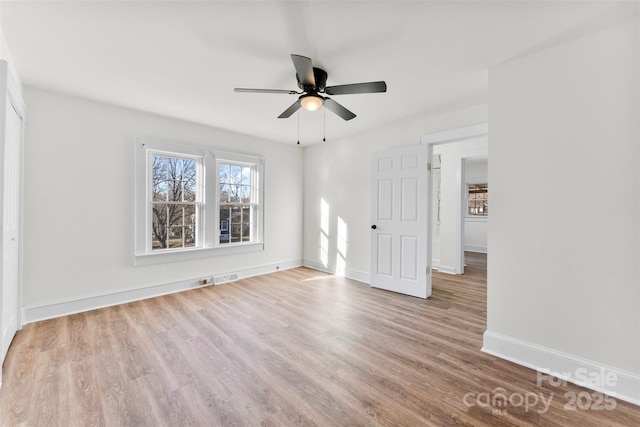 unfurnished room with ceiling fan and light hardwood / wood-style flooring