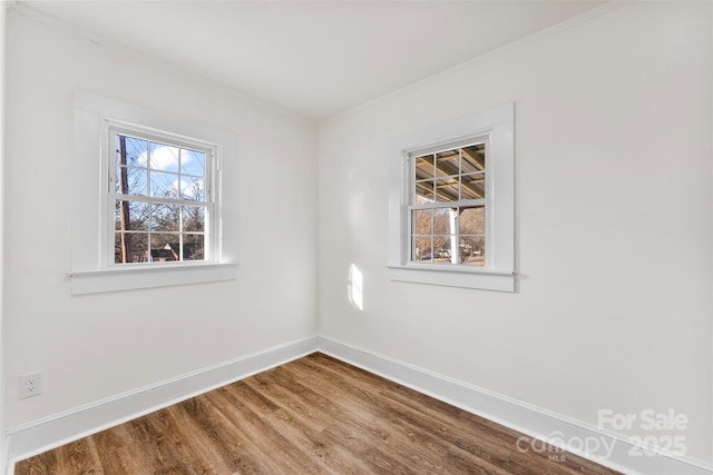 unfurnished room featuring wood-type flooring