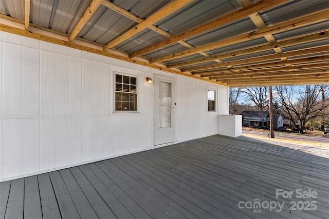 wooden deck featuring a grill