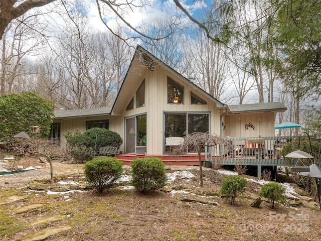 rear view of house featuring a deck