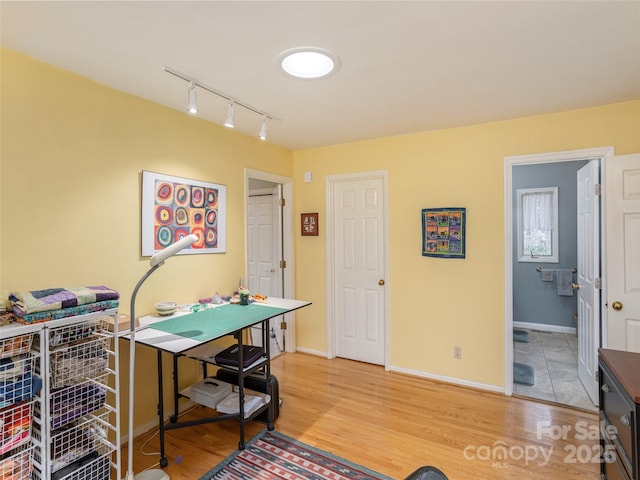 home office with wood-type flooring