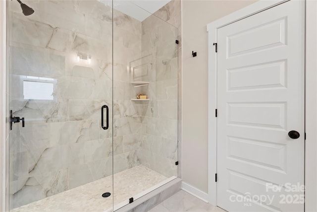 bathroom featuring tile patterned floors and a shower with door