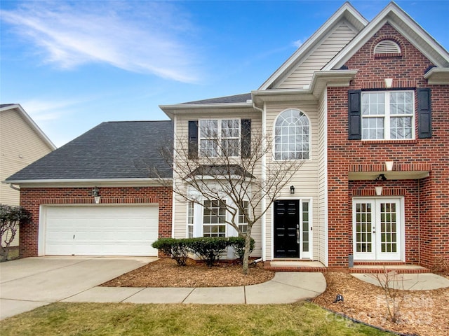 view of front of house with french doors and a garage