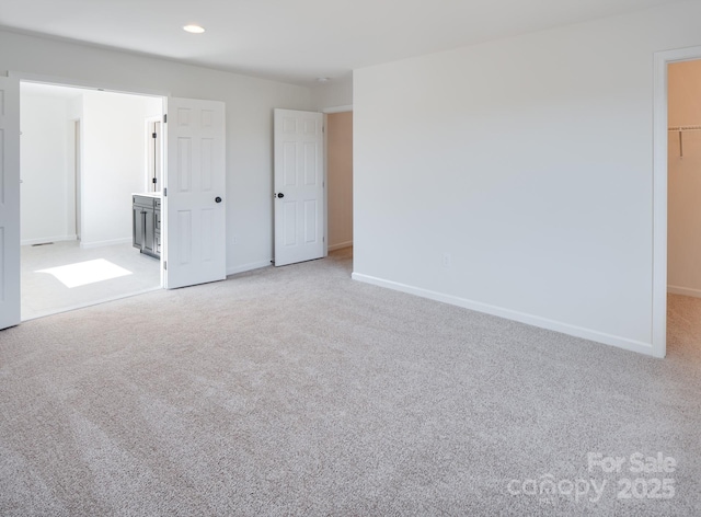 empty room featuring light carpet