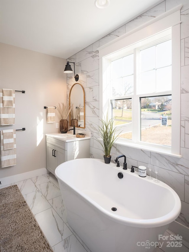 bathroom with vanity and a bathtub