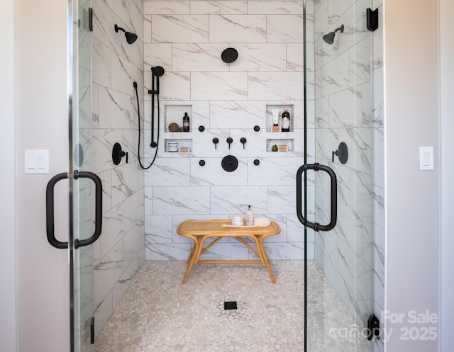 bathroom featuring an enclosed shower