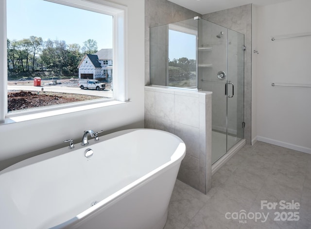 bathroom with separate shower and tub