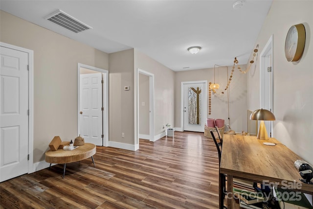 foyer entrance with dark hardwood / wood-style flooring