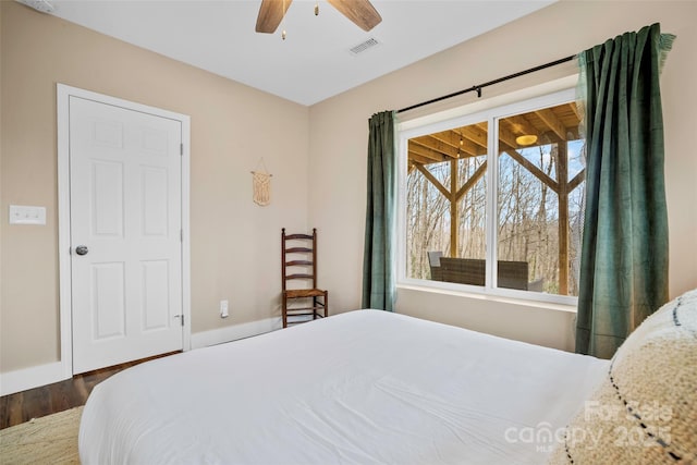 bedroom featuring dark wood-type flooring and ceiling fan