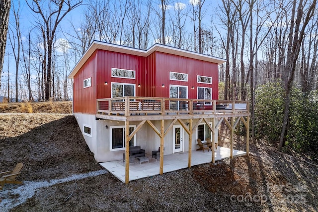 exterior space featuring a patio and a wooden deck