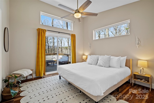 186 S Slope Ln, Old Fort, NC 28762 - bedroom with multiple windows, wood finished floors, ceiling fan, and access to outside
