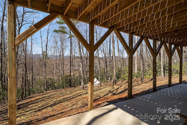 186 S Slope Ln, Old Fort, NC 28762 - view of patio / terrace featuring a view of trees