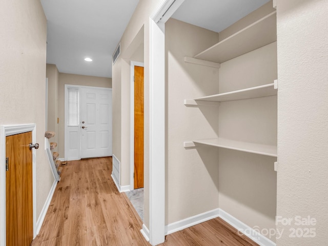 hallway featuring light wood-type flooring