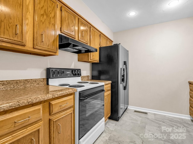 kitchen featuring stainless steel fridge with ice dispenser and electric stove