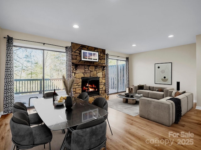 60 Vista View Ct, Etowah, NC 28729 - living room featuring a stone fireplace, recessed lighting, baseboards, and wood finished floors