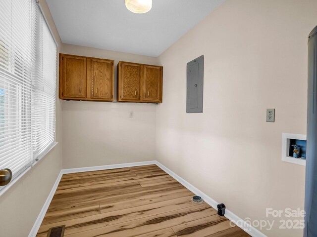 60 Vista View Ct, Etowah, NC 28729 - washroom featuring washer hookup, baseboards, electric panel, and cabinet space