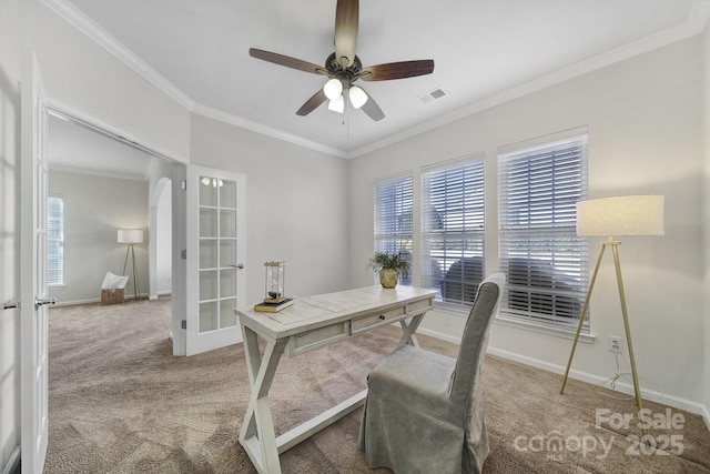 office space with french doors, ceiling fan, carpet flooring, and crown molding