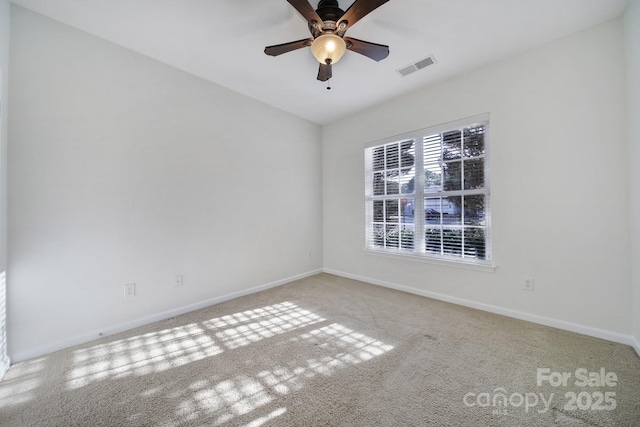 empty room with light colored carpet and ceiling fan