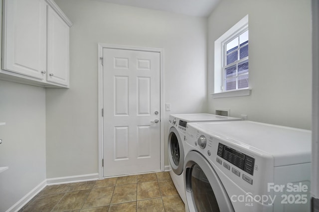 laundry room featuring independent washer and dryer, cabinets, and light tile patterned floors