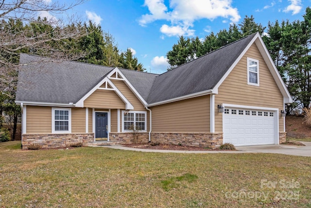 view of front of property featuring a garage and a front yard