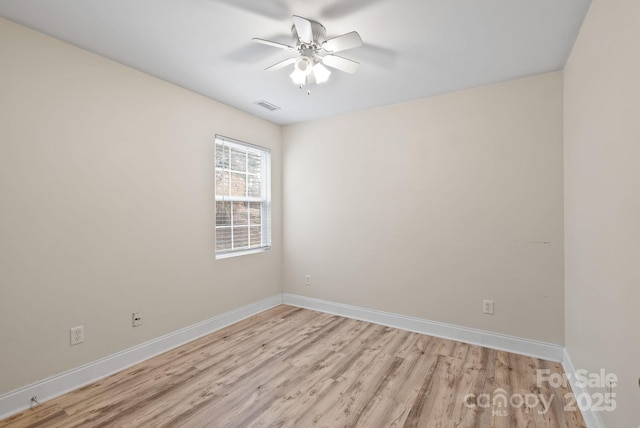 empty room featuring ceiling fan and light wood-type flooring