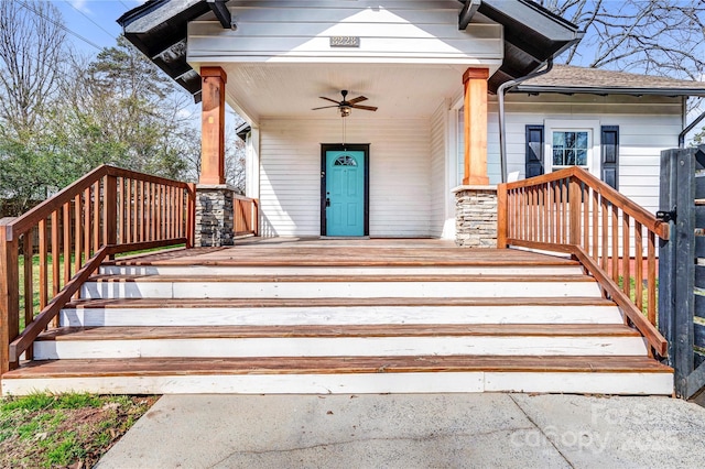 entrance to property featuring ceiling fan and a porch