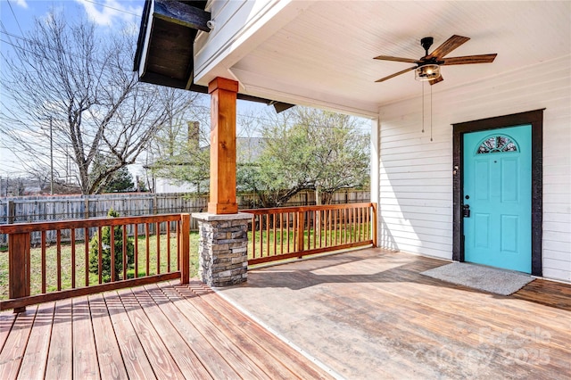 deck featuring a fenced backyard and a ceiling fan