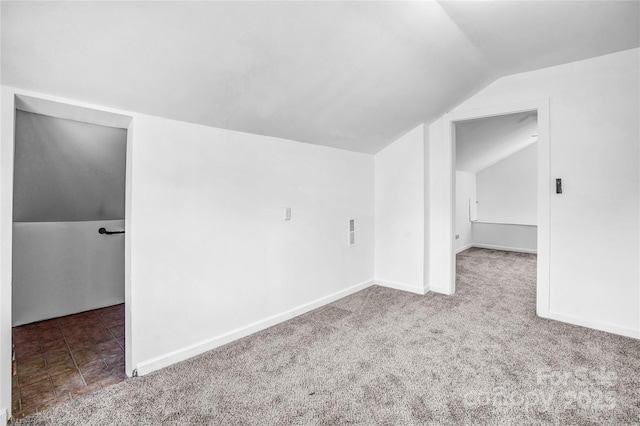 bonus room with carpet flooring, vaulted ceiling, and baseboards