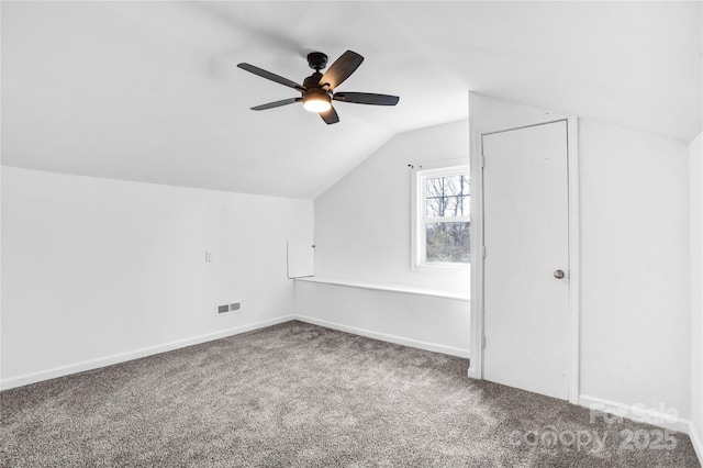 bonus room featuring visible vents, baseboards, ceiling fan, carpet, and vaulted ceiling