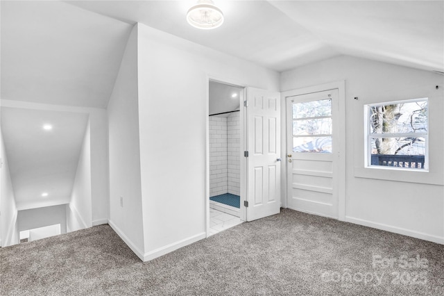 bonus room featuring carpet floors, baseboards, and vaulted ceiling