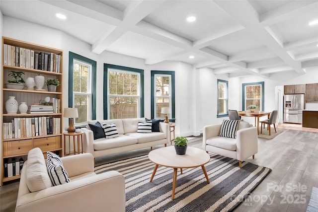 living area featuring light wood-style flooring, recessed lighting, coffered ceiling, baseboards, and beam ceiling